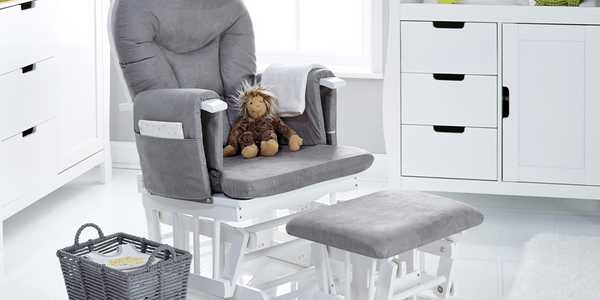 An Obaby reclining glider chair and stool in grey and white colour placed in a white room. 